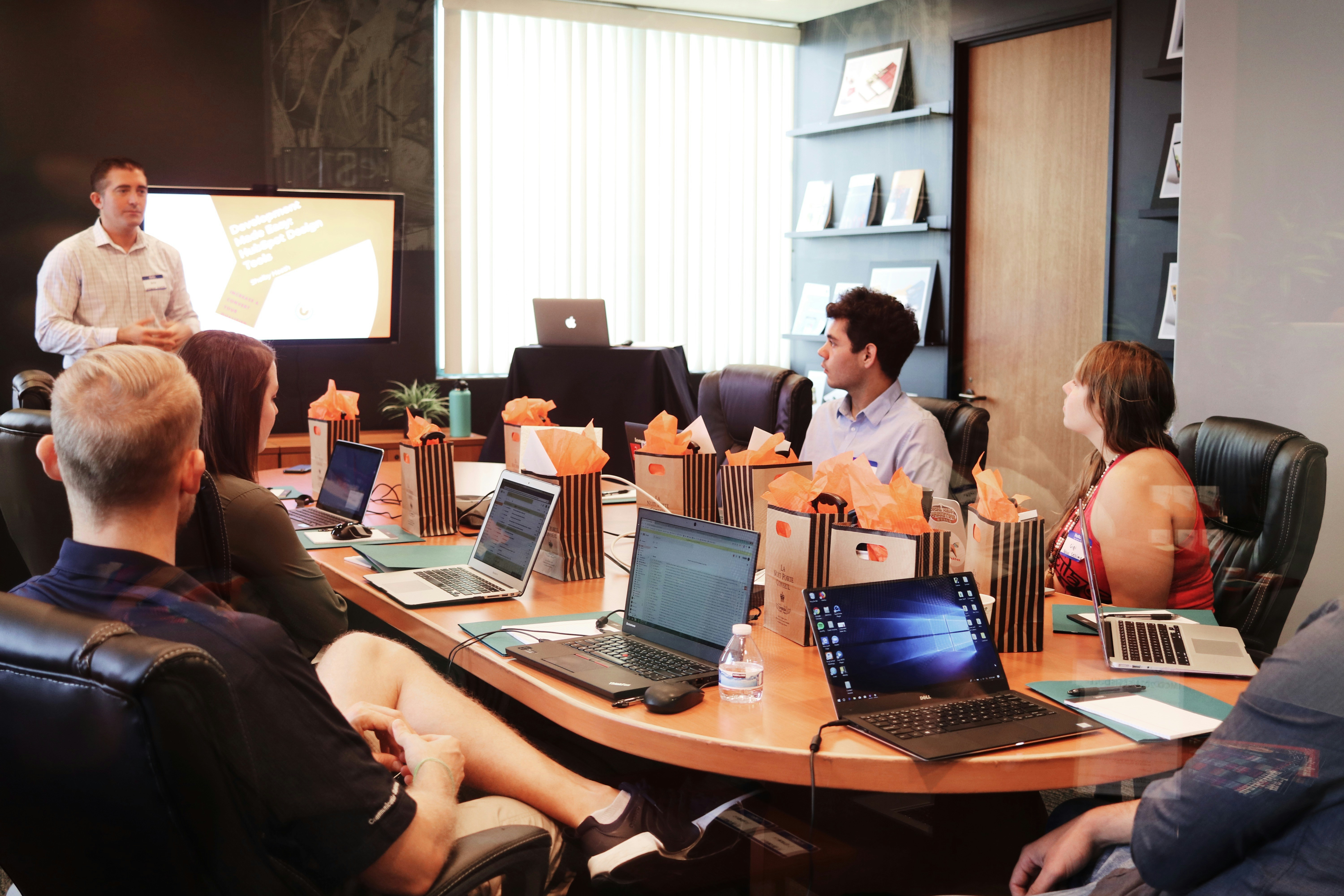 WE TECH team presenting a strategy to a client